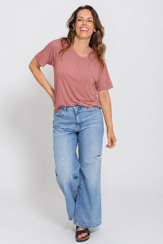 Classic Bamboo T-Shirt in Rosewood, full length front view on model with hand on hip, styled with wide leg jeans.