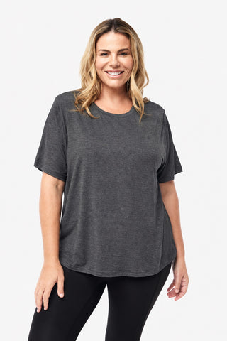 Classic Bamboo T-Shirt in Dark Grey Marle, front view on model smiling, styled with black leggings.
