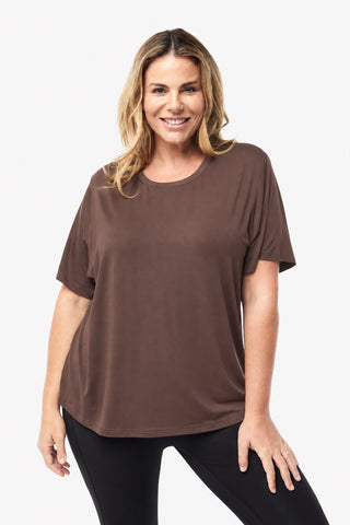 Classic Bamboo T-Shirt in Mocha, front view on model smiling, styled with black leggings.