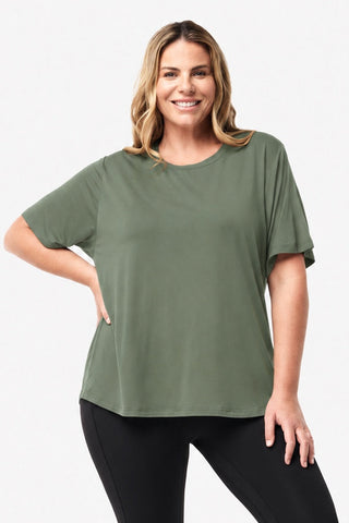 Classic Bamboo T-Shirt in Moss, front view on model with hand on hip, styled with black leggings.