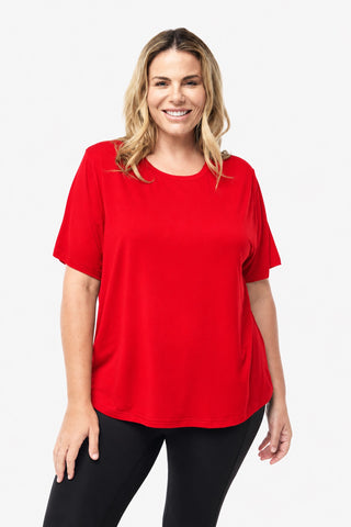 Classic Bamboo T-Shirt in Red, front view on model smiling, styled with black leggings.