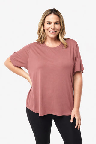 Classic Bamboo T-Shirt in Rosewood, front view on model with hand on hip, styled with black leggings.