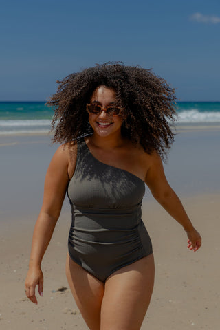 Esperance Core Support One Piece Swim in Khaki Texture, front view on model walking on the beach