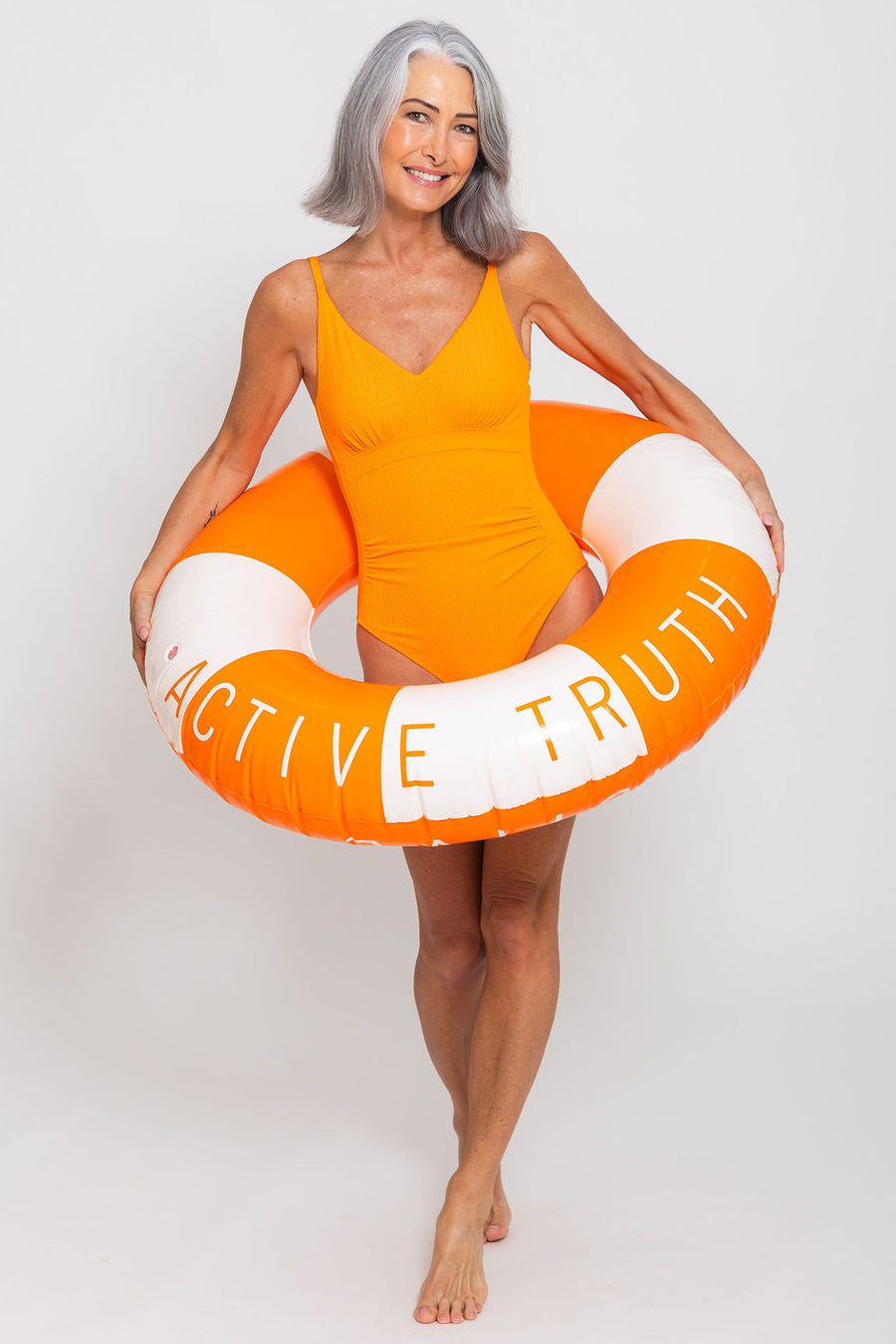 Coolum Core Support One Piece Swim in Orange Pop Texture, front view on model standing poolside. Model: Model wears a size S. She is size 10 and 178cm tall.