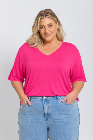 Bamboo V-Neck T-Shirt in Raspberry, front view on model with hands in pockets, styled with denim jeans.