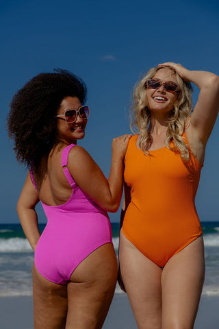Sorrento Core Support One Piece Swim in Hot Pink Texture, back view on model beside a second model in Orange Pop