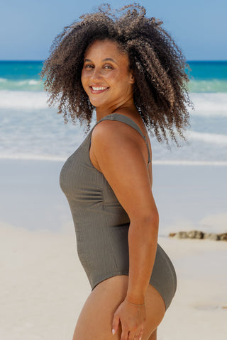 Sorrento Core Support One Piece Swim in Khaki Texture, side view on model looking over her shoulder