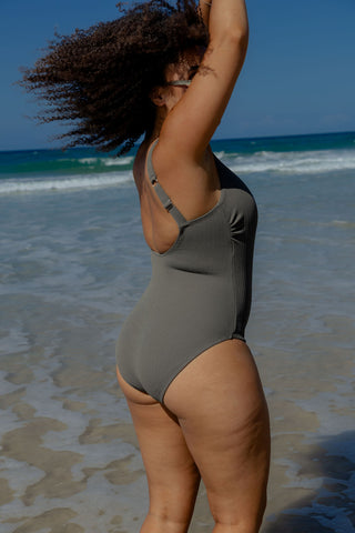 Sorrento Core Support One Piece Swim in Khaki Texture, back view on model in the surf