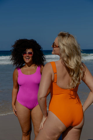 Sorrento Core Support One Piece Swim in Orange Pop Texture, back view on model beside a second model in Hot Pink